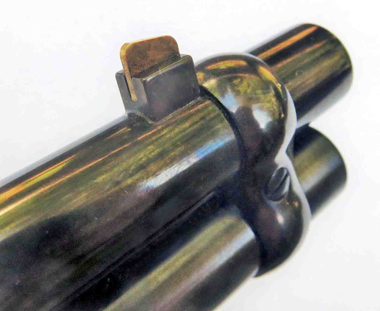 A pinned blade for the front sight, behind the barrel band.